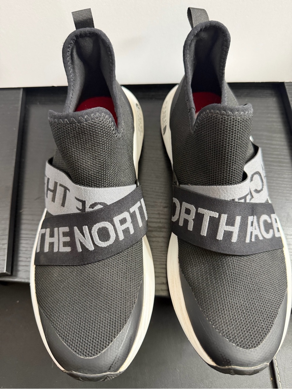 The North Face Women's Black Knit Slip-On Sneakers with Gray Branded Straps